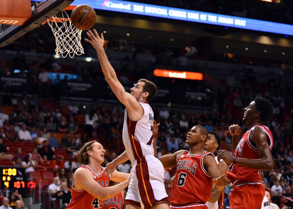 Mar 1, 2016; Miami, FL, USA; Miami Heat guard Goran Dragic (7) scores past Chicago Bulls forward Cameron Bairstow (41) during the second half at American Airlines Arena. The Heat won 129-111. Mandatory Credit: Steve Mitchell-USA TODAY Sports *** Please Use Credit from Credit Field ***, Image: 275946499, License: Rights-managed, Restrictions: *** World Rights ***, Model Release: no, Credit line: Profimedia, SIPA USA